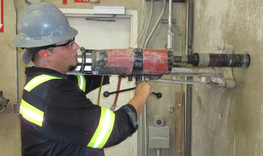 man using electric drill